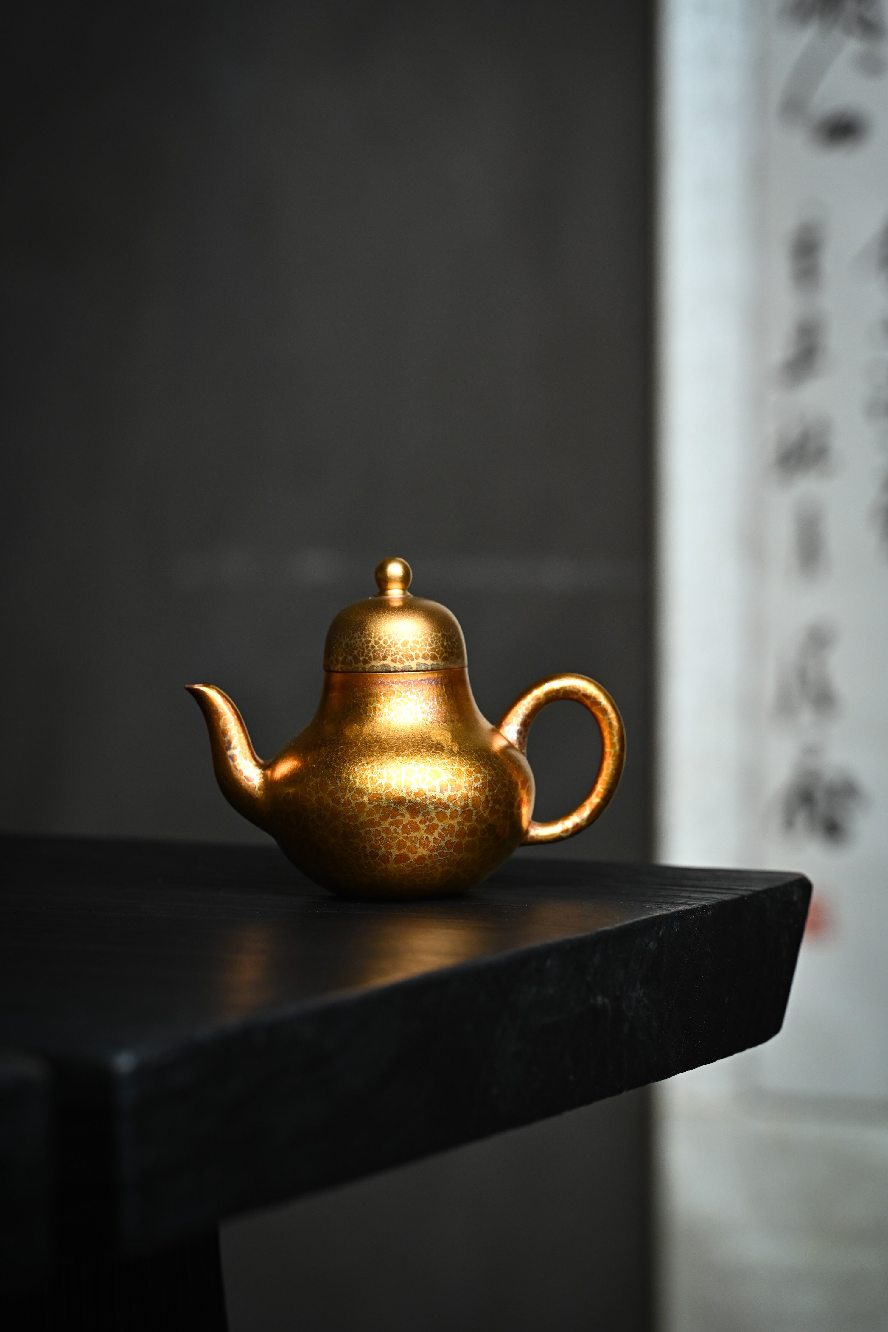 Handmade YANYOO Yixing teapot featuring Feather-Plume firing technique, Si Ting, lifestyle wide-angle left side.