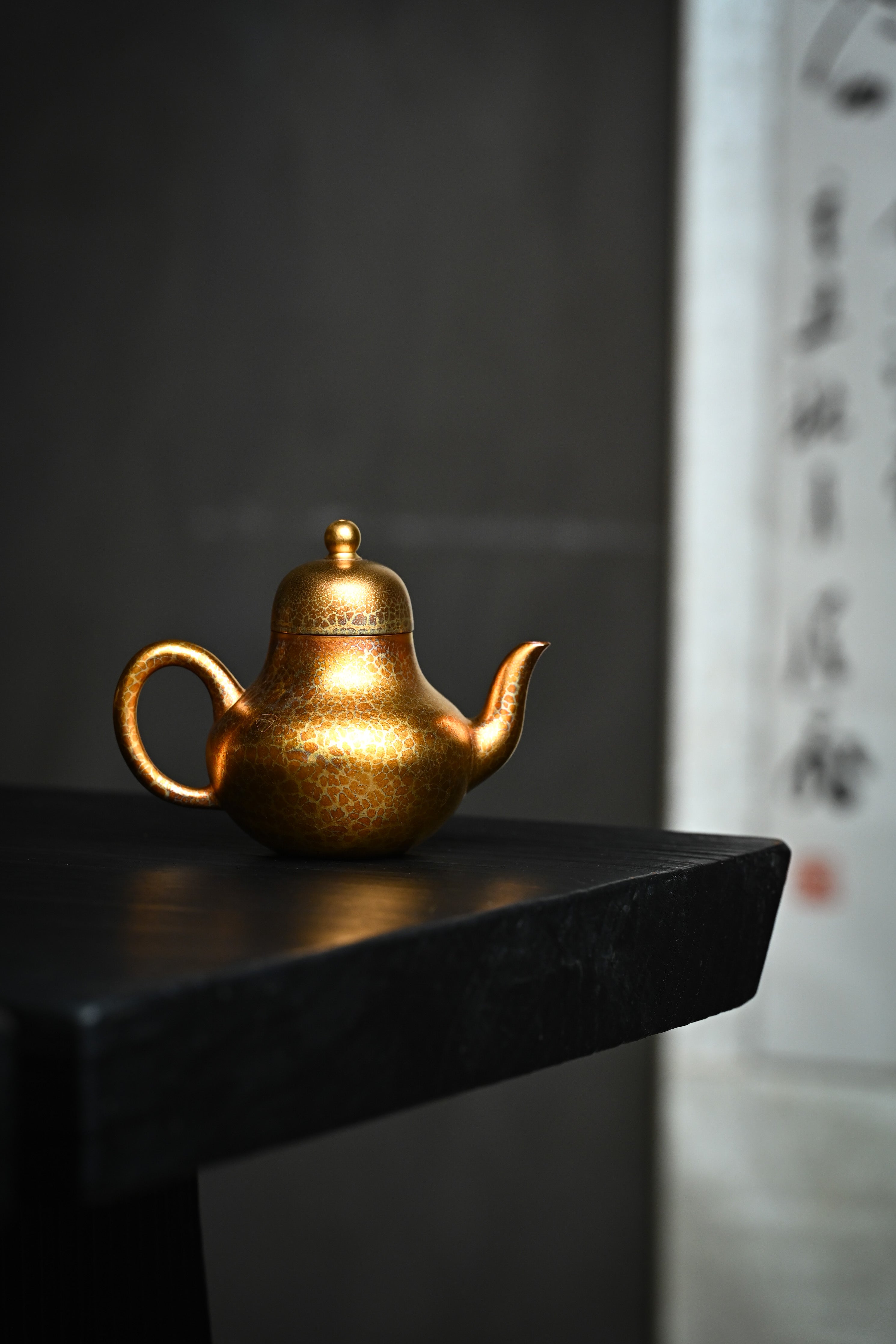 Handmade YANYOO Yixing teapot featuring Feather-Plume firing technique, Si Ting, lifestyle wide-angle right side.