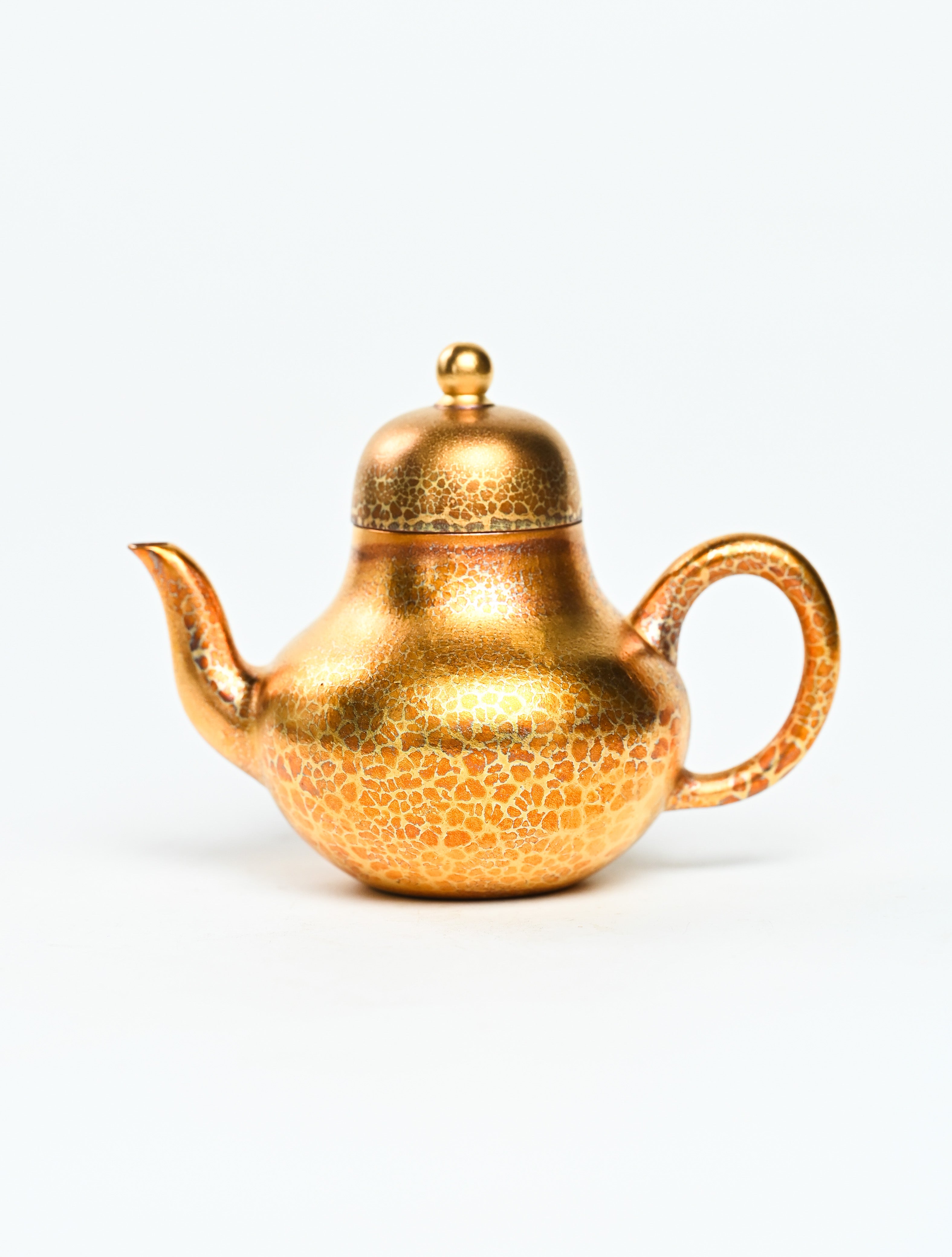 YANYOO handmade Yixing teapot featuring Feather-Plume firing technique, Si Ting gold, product left side.