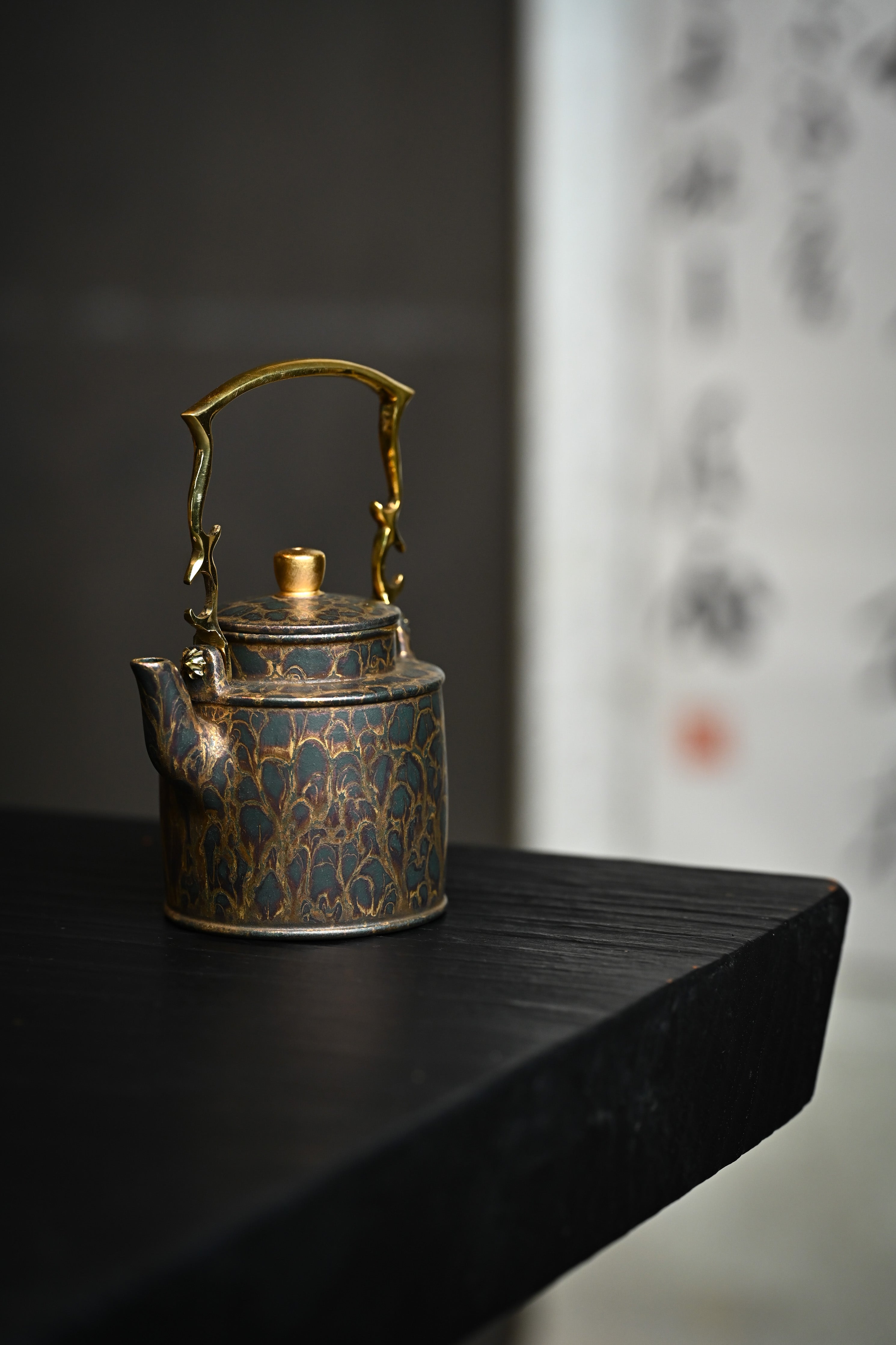 Handmade YANYOO Yixing teapot featuring Feather-Plume firing technique, Yang Tong, lifestyle front side.