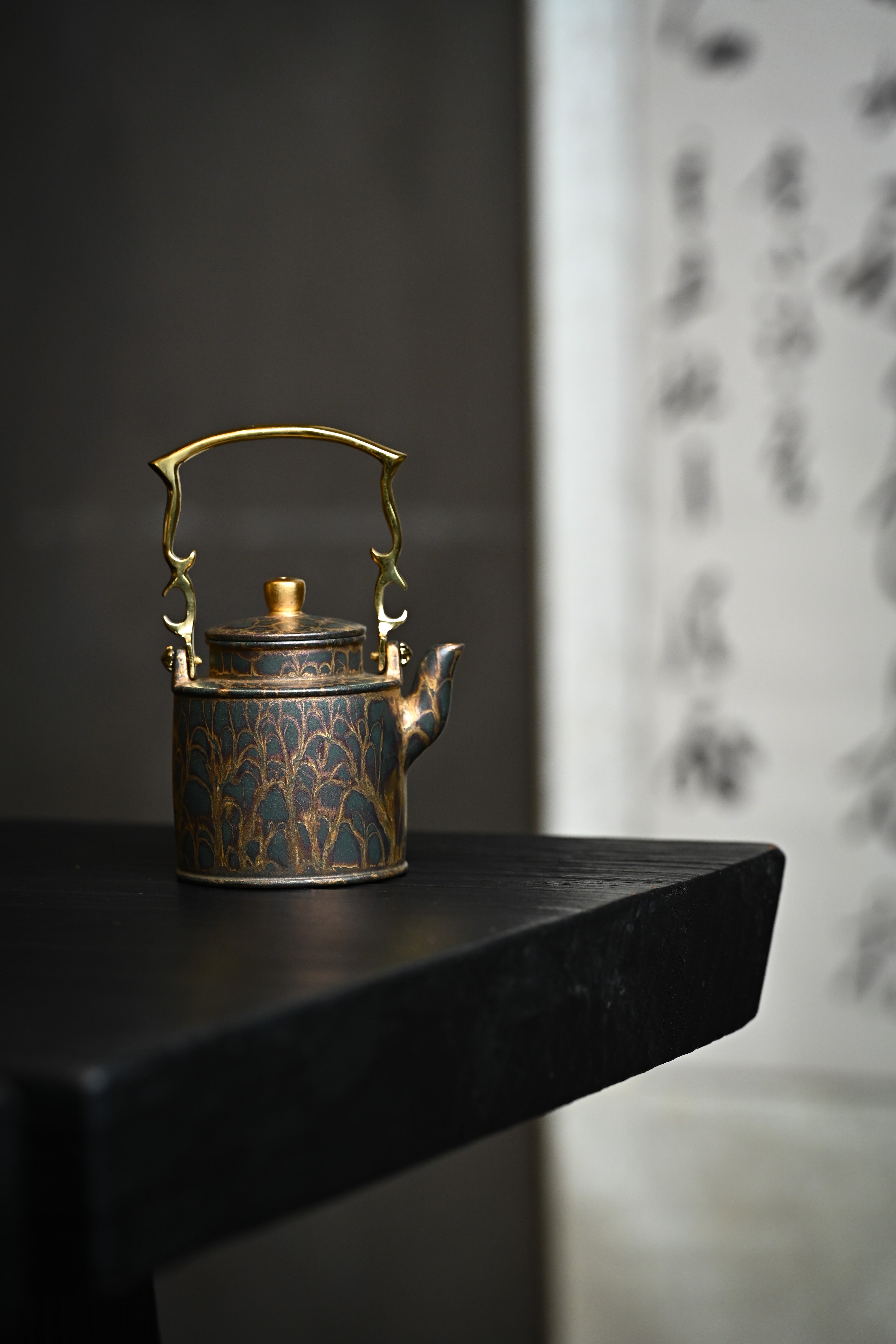 Handmade YANYOO Yixing teapot featuring Feather-Plume firing technique, Yang Tong, lifestyle wide-angle right side.